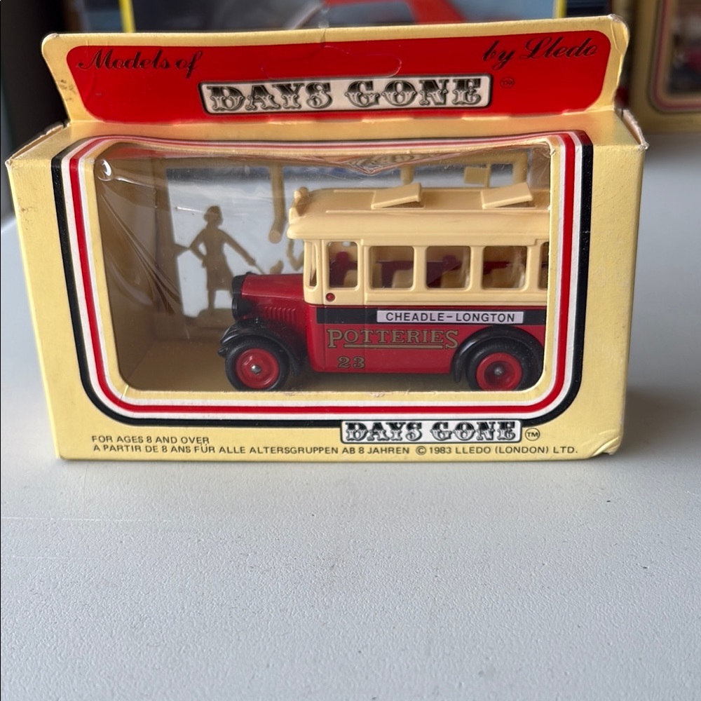 Red and Cream Toy Bus